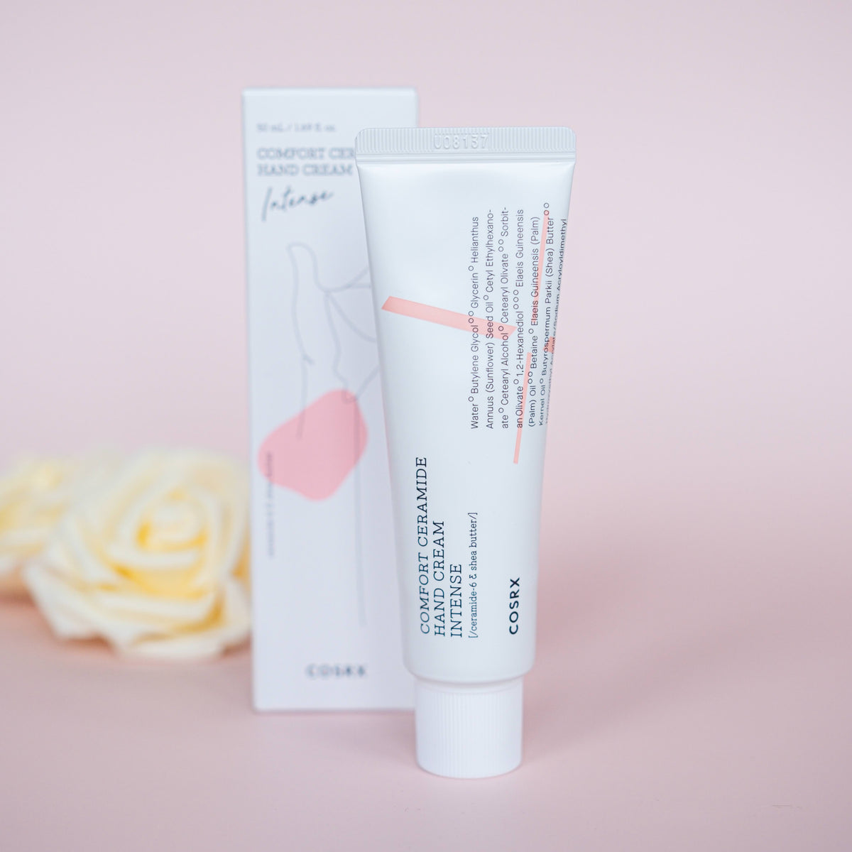 COSRX Balancium Comfort Ceramide Intense Soothing Hand Cream naast bloemen
