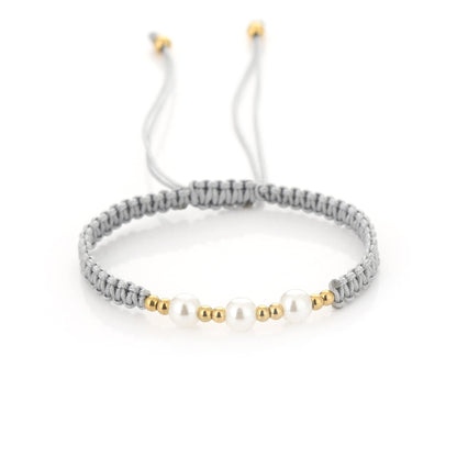 Gevlochten koord armband met kralen